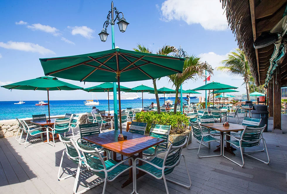 The outdoor deck, overlooking the Caribbean Sea, of Sunset House on South Sound, Grand Cayman.