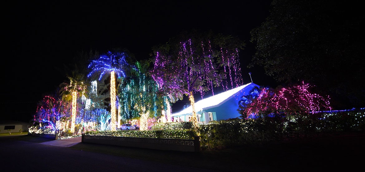 A beautiful Cayman Cottage decorated with Christmas lights.