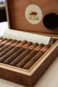 Cigars in a 'Cayman Cigar Company' box.