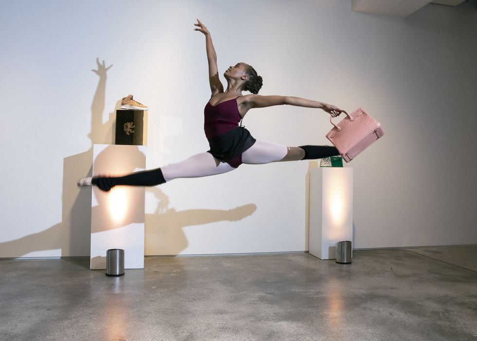 A ballet dancer performing an impressive jump.