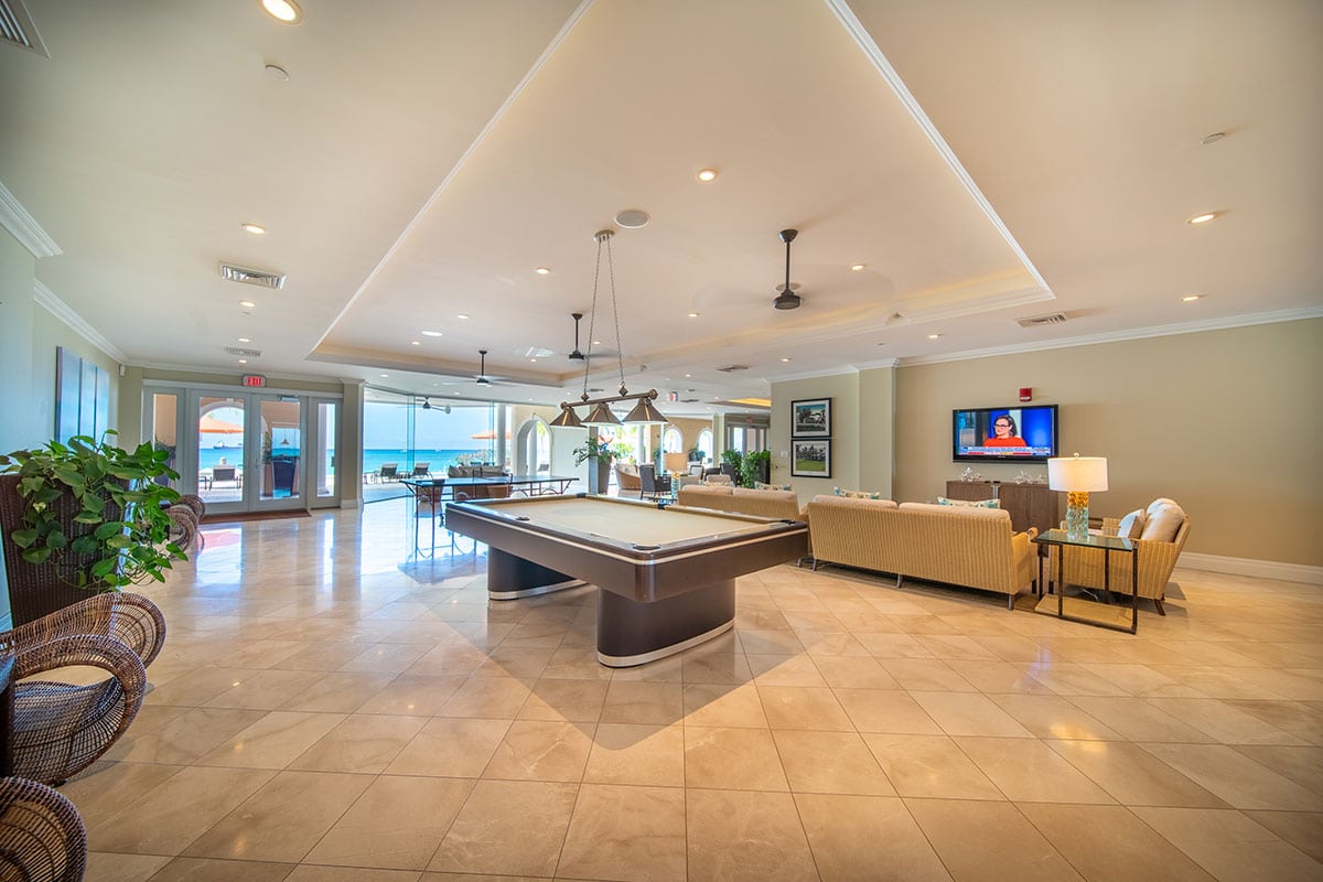 Expansive living area/ games room in a Waters Edge unit on Seven Mile Beach.