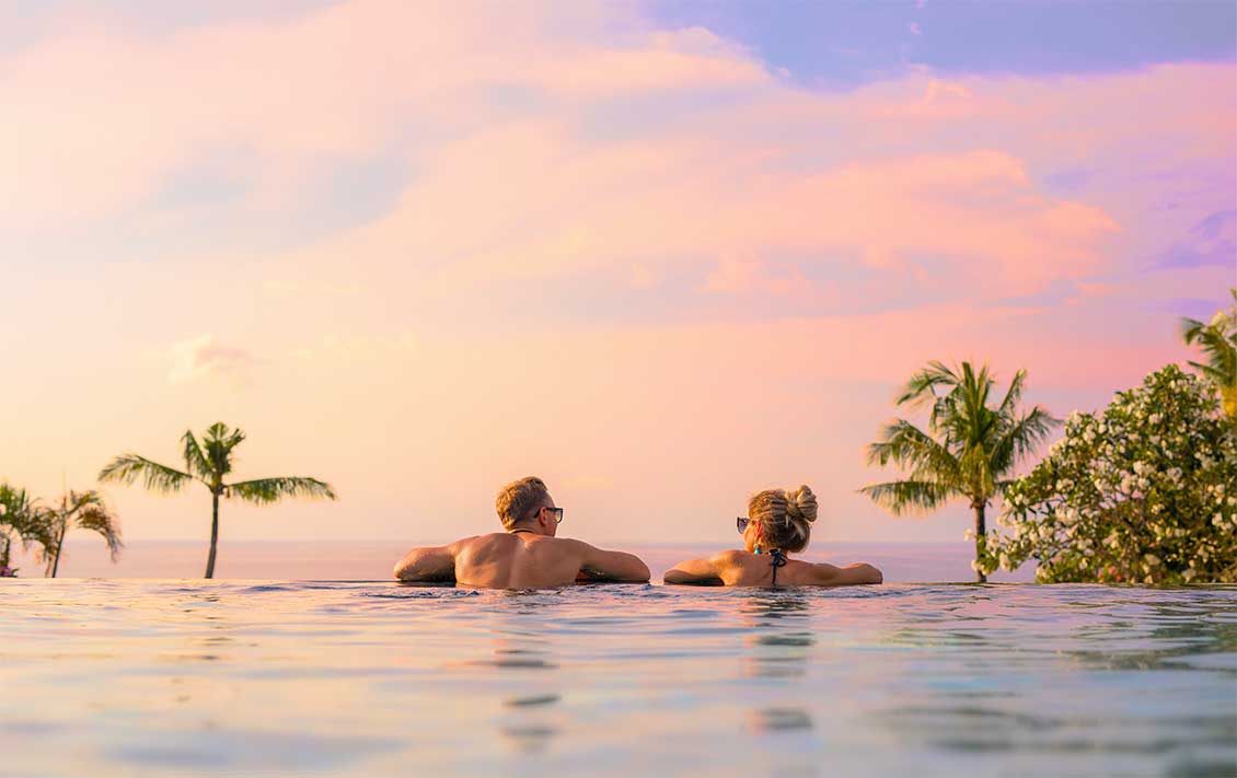 sunset-couple-infinity-swimming-pool