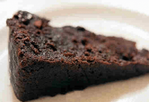 A plate with a slice of Christmas cake.