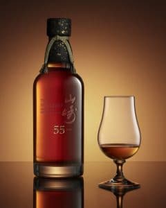 A rum glass and bottle of House of Suntory’s Yamazaki 55 Years Old