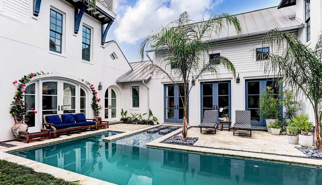 Rear elevation and pool area of a Manor home in Houston, Texas listed by a local Sotheby's International Realty  brokerage.