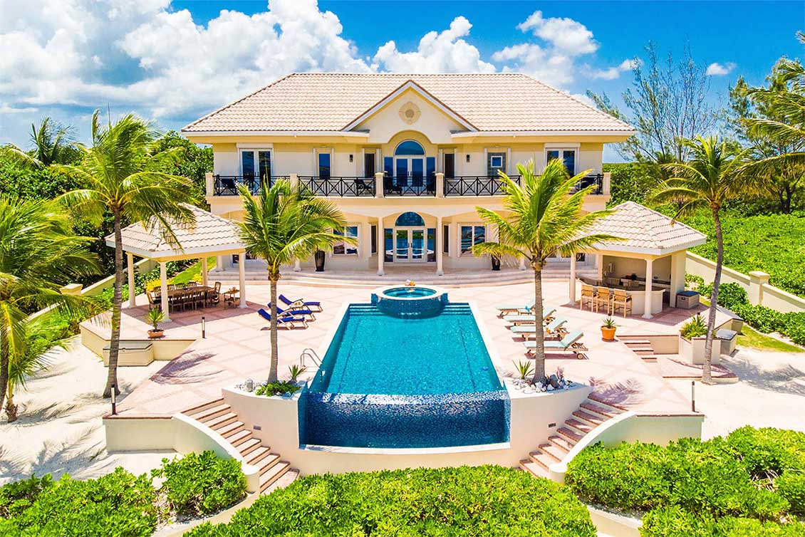 Aerial view of the pool area and rear elevation of Blue Water Therapy on Grand Cayman