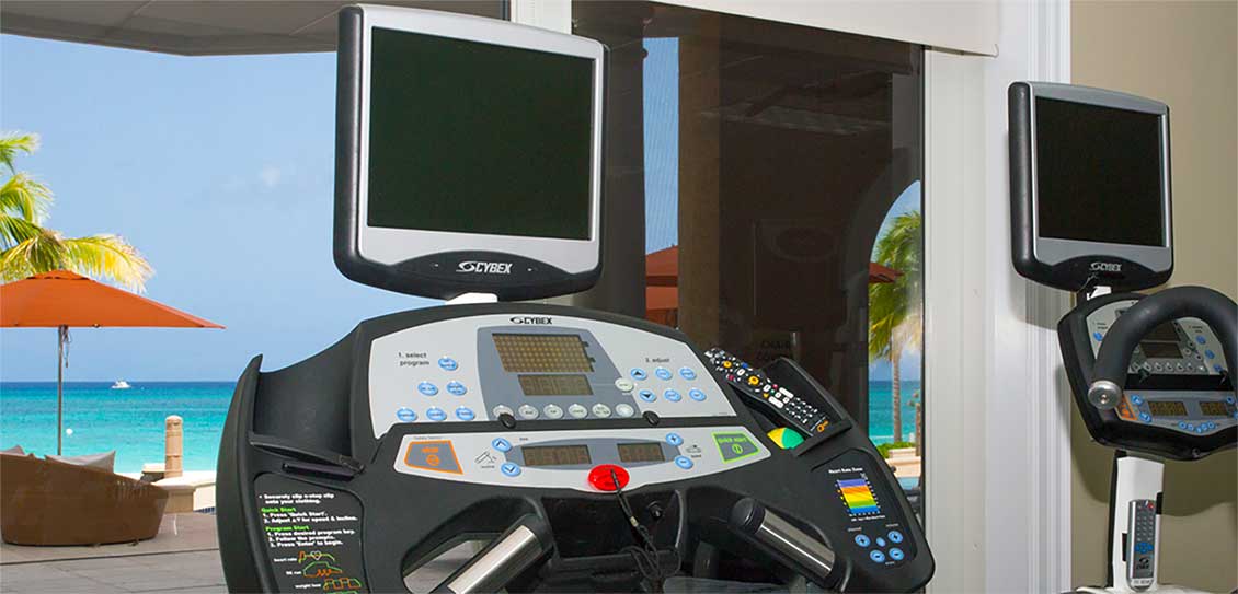 Exercise equipment with the Caribbean Sea in the background.