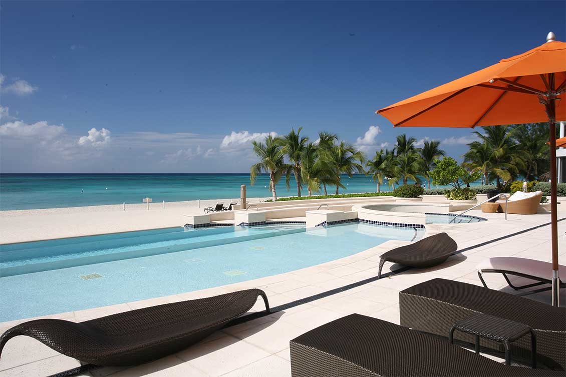 Views of the Caribbean Sea from a pool front lounger at Waters Edge, Seven Mile Beach.