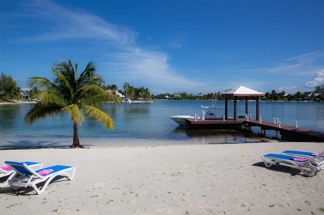 Beachfront dock view from private beach in Cayman Kai, Grand Cayman.