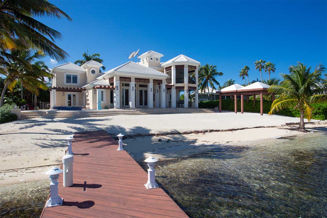 Rear elevation view from beachfront private dock.