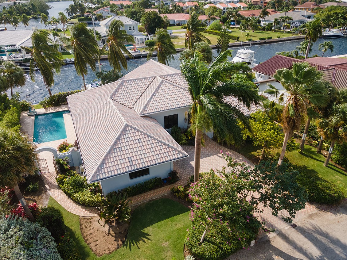 Aerial view of a canal front property in Jellicoe Quay in Governor's Harbour on Seven Mile Beach, Grand Cayman.