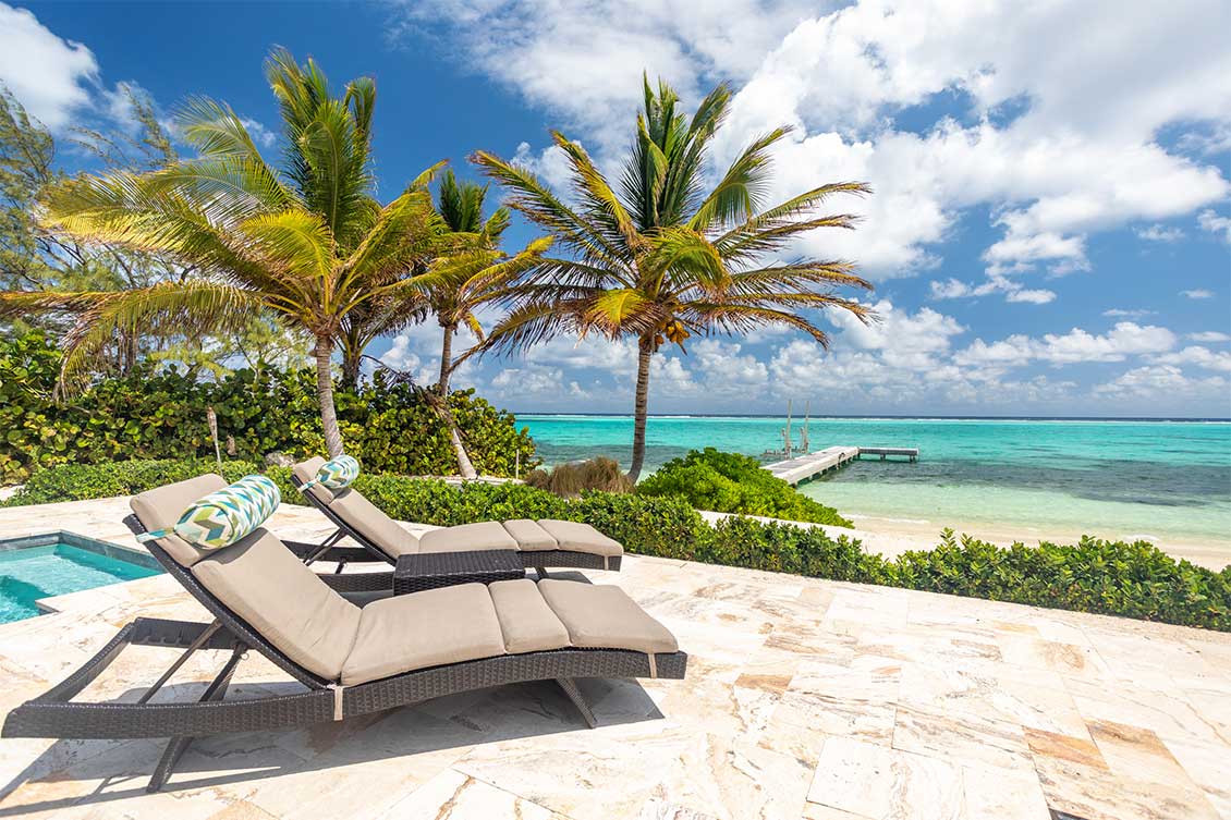 A view across the pool deck of the private jetty in the Caribbean Sea.