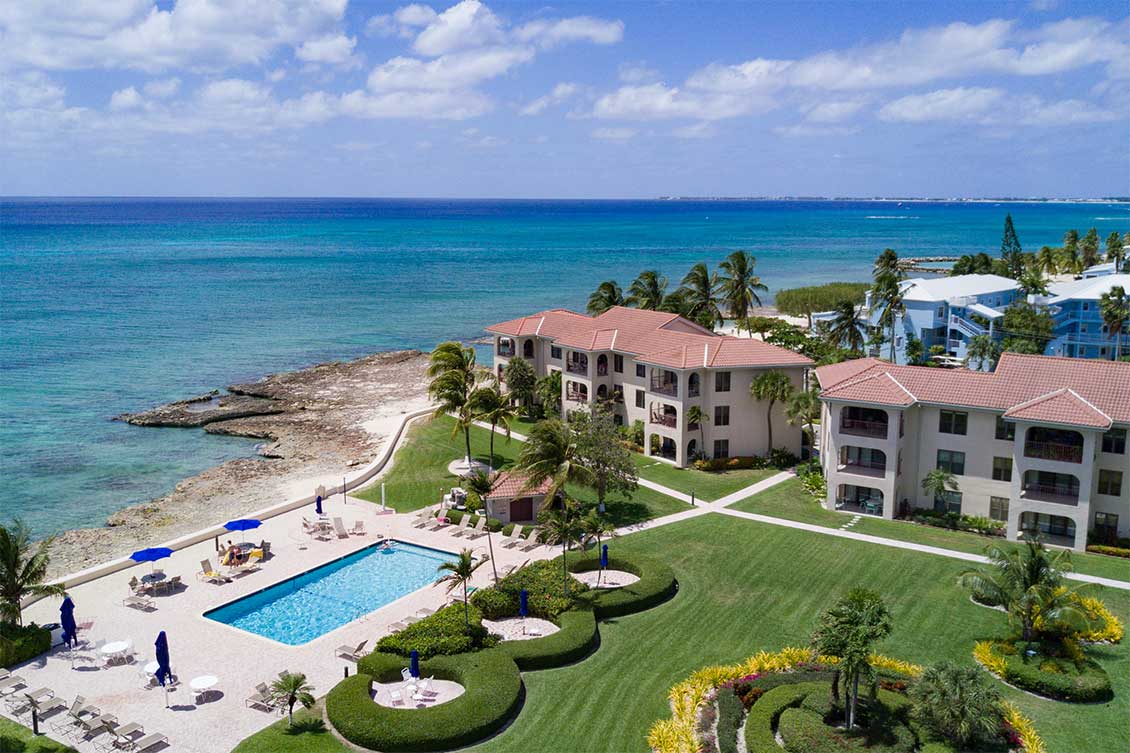 Aerial shot of the grounds and pool of George Town Villas on Seven Mile Beach, Grand Cayman.