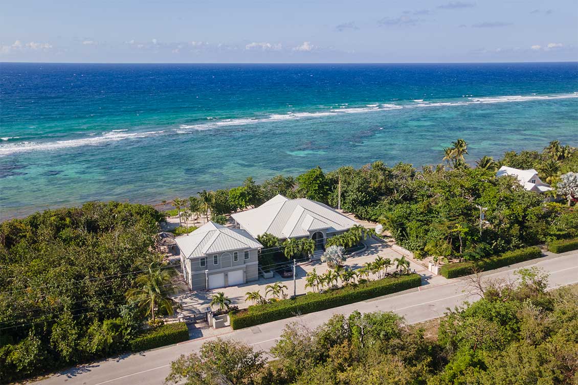 Aerial view of Moon Shadow a waterfront property in the North of the island with panoramic sea views.