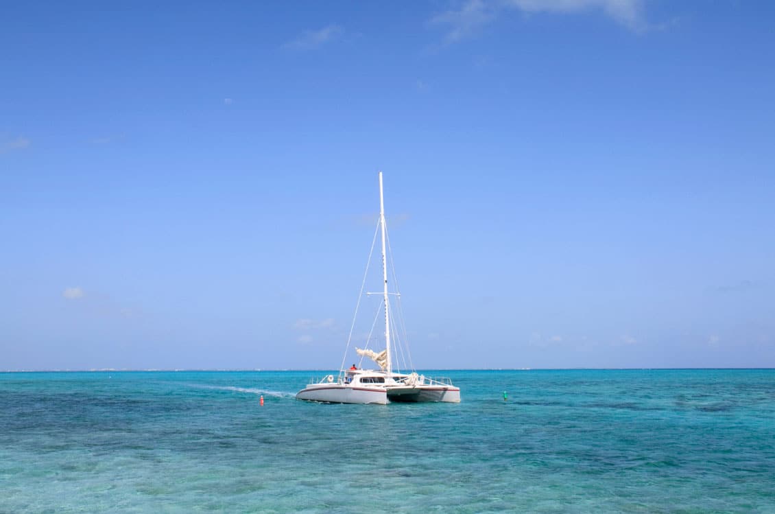A catamaran sailing on the Caribbean Sea of the Cayman Islands