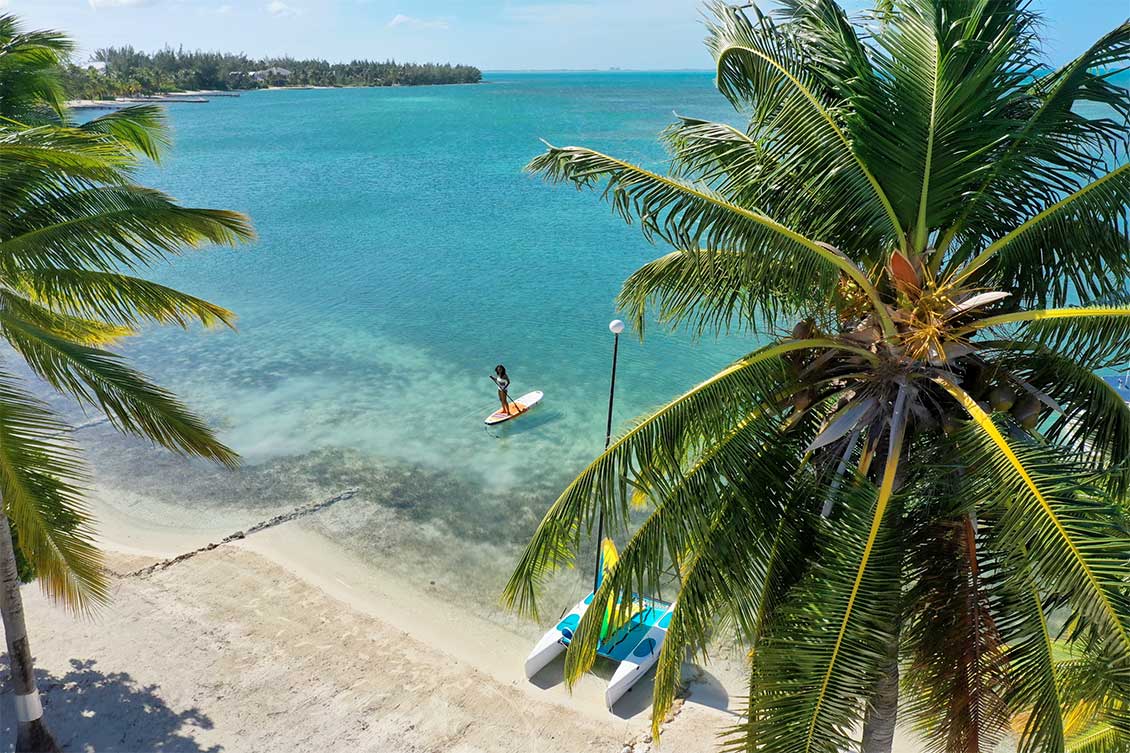Paddleboarding is just one of the many ways residents make the most of Cayman's calm, crystal-clear waters and year-round sunshine.