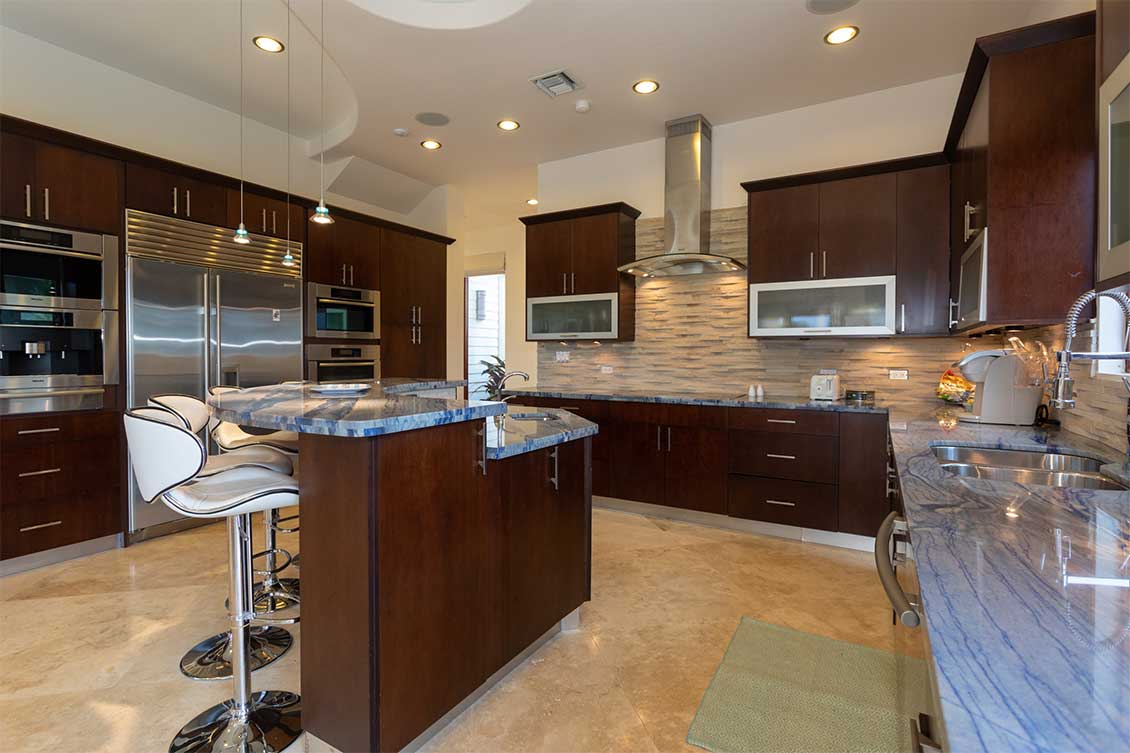 Stylish dark wood kitchen at Compound Kai, Grand Cayman