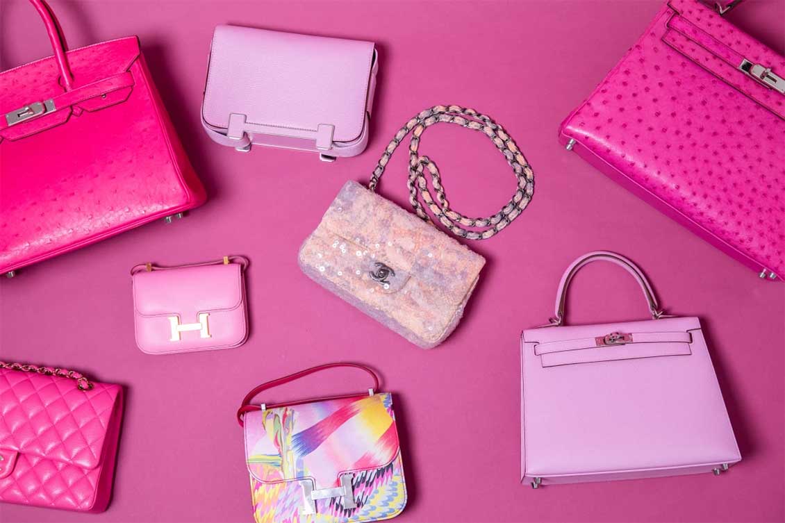 ASSORTED HANDBAGS INCLUDING AN HERMÈS FUCHSIA OSTRICH KELLY (TOP RIGHT) AND MAUVE KELLY (BOTTOM RIGHT) WITH A CHANEL CLASSIC SINGLE FLAP (CENTER)