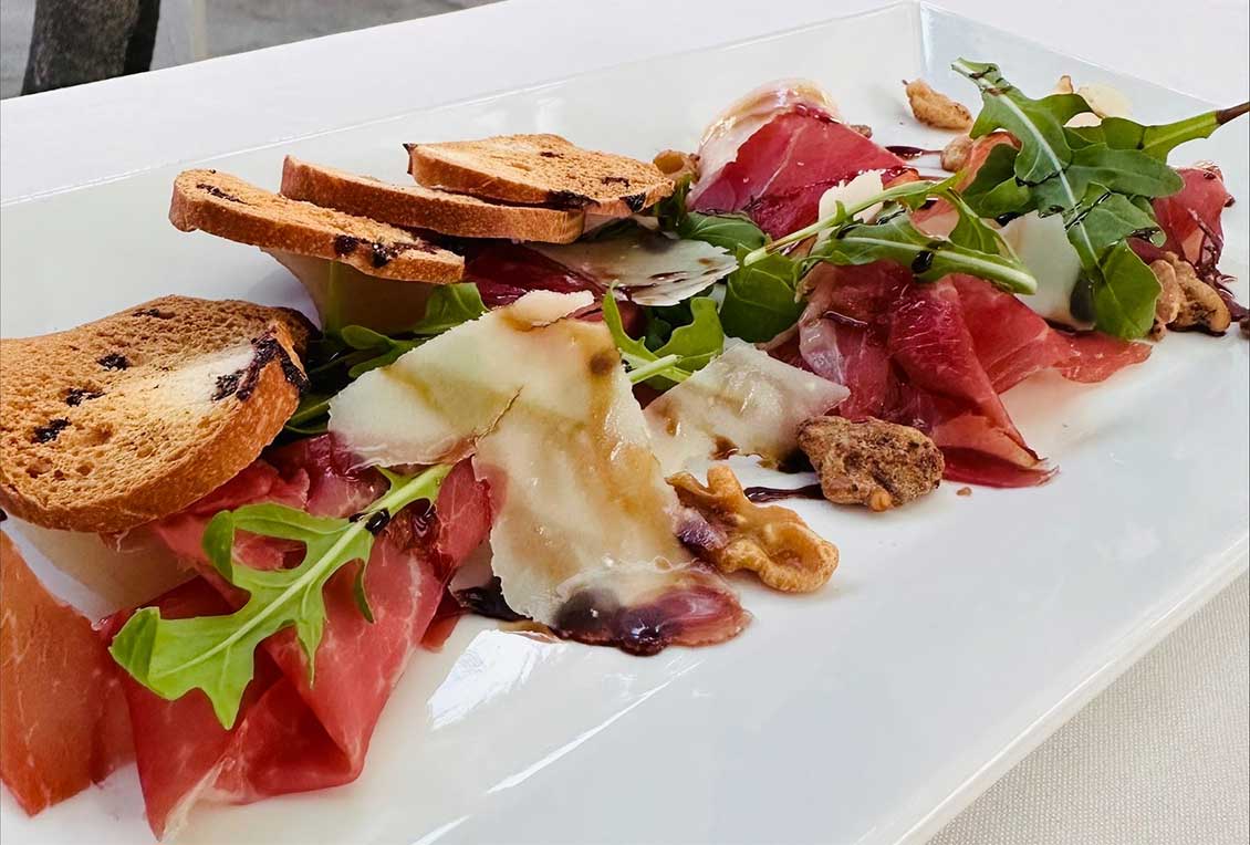 Close up of a Spanish ham dish with walnuts, cheese and rocket from the Grand Old House, Cayman Islands