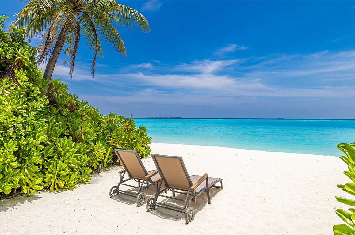 Sun loungers on Seven Mile Beach