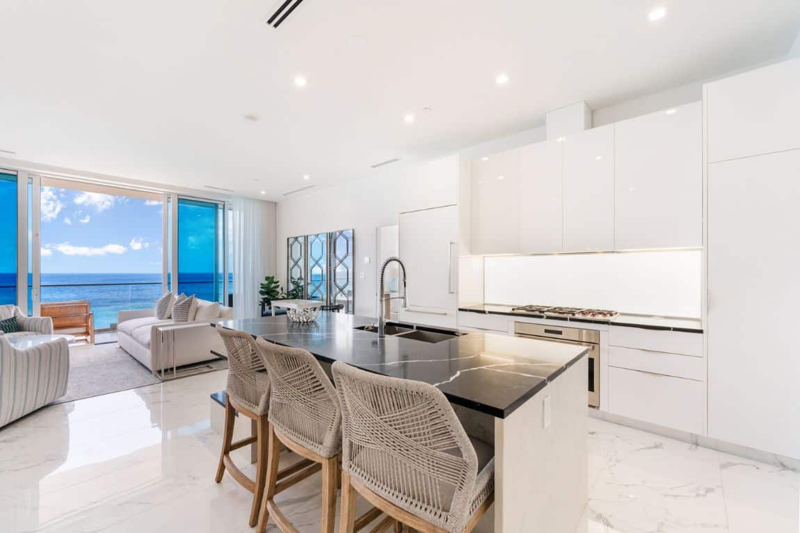 Sleek contemporary kitchen with ocean views at Fin Oceanfront Corner Residence