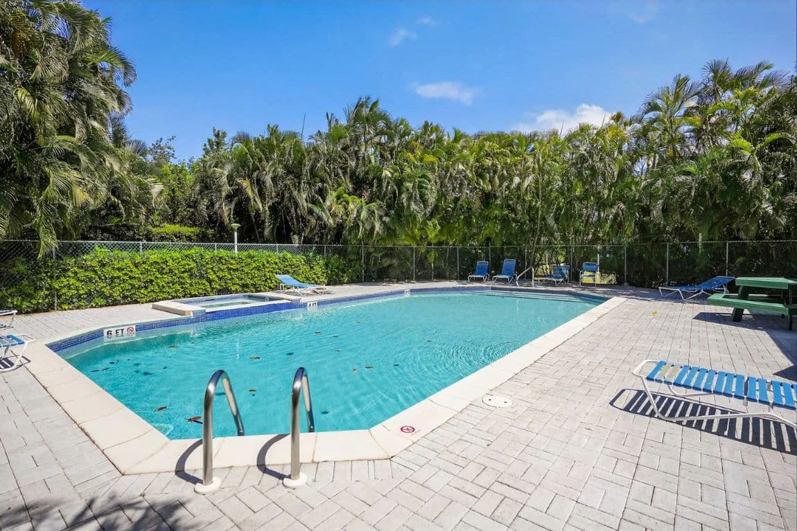 Secret Garden — a quiet pool setting surrounded by greenery, designed for relaxed days in the sun.