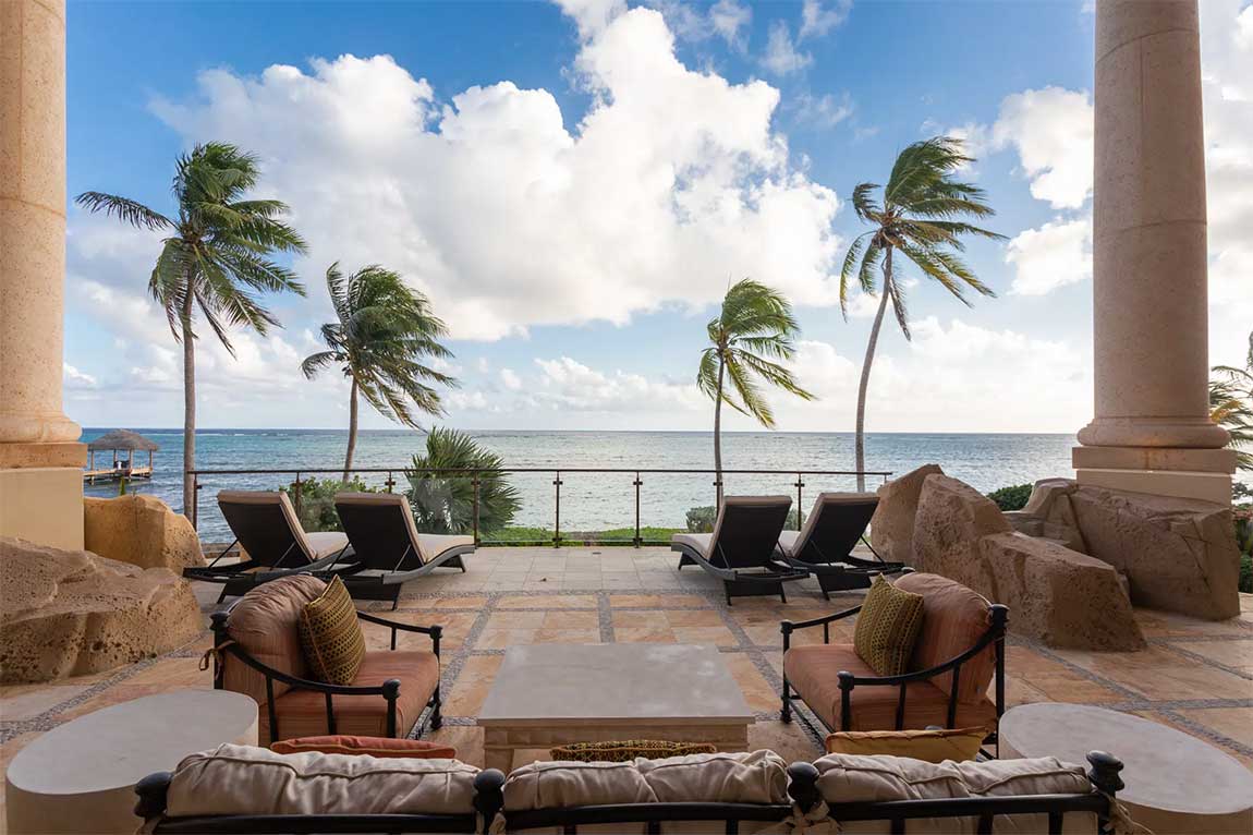 Castillo Caribe's oceanfront veranda opens directly to sweeping views of the Caribbean Sea.